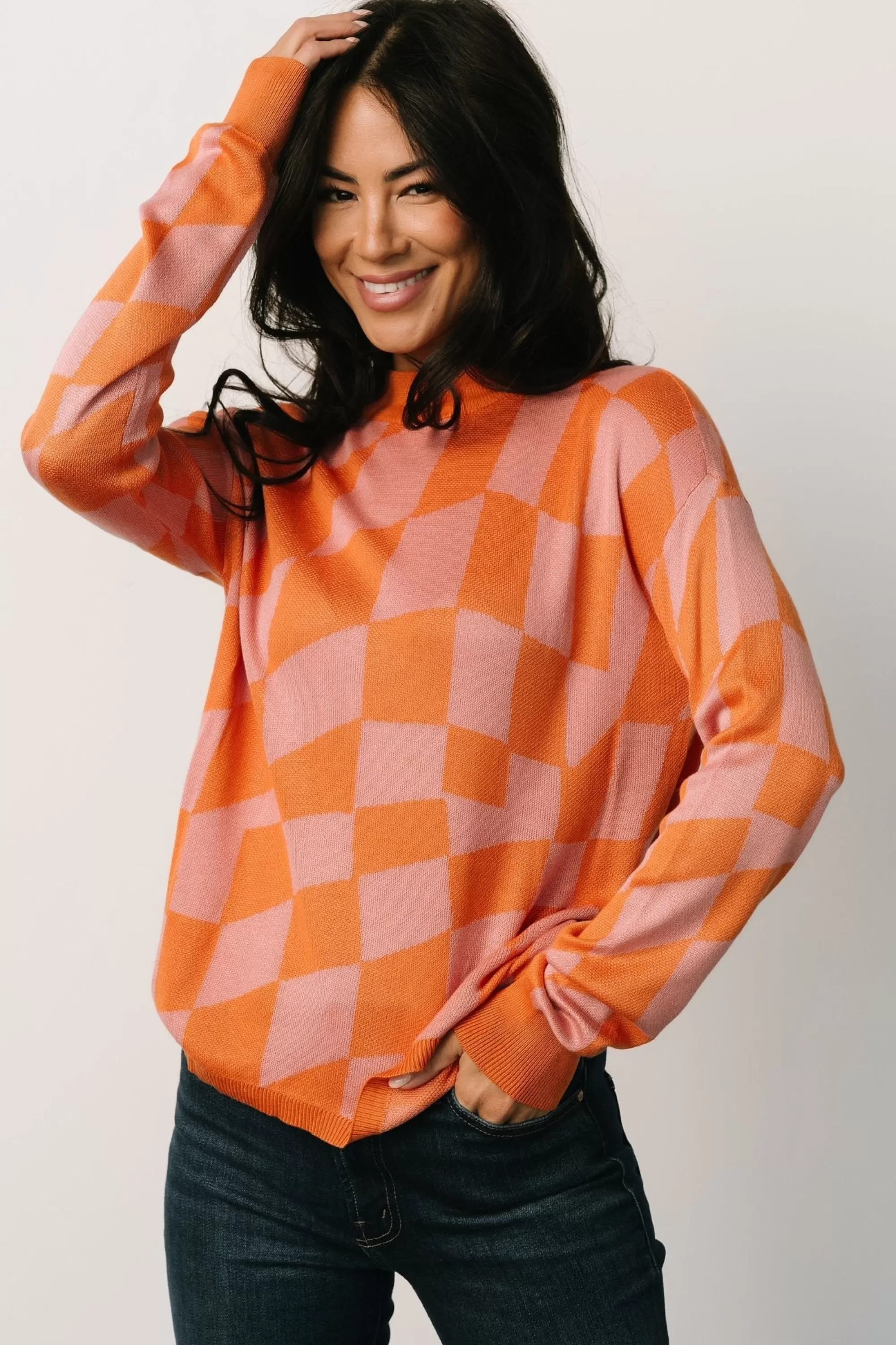 Baltic Born sweaters | Travis Checkered Sweater | Orange + Pink